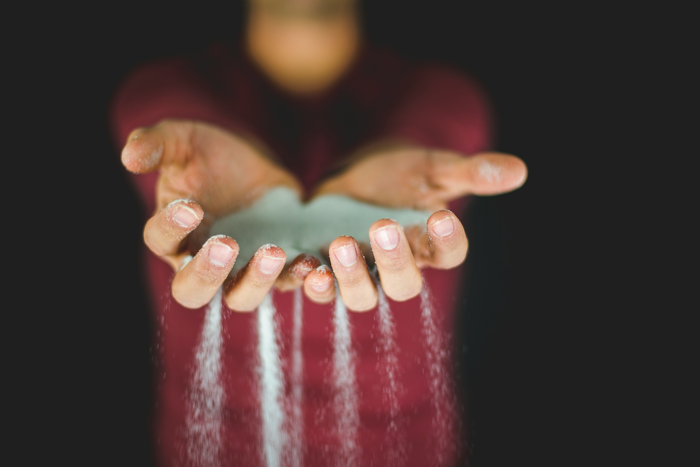 Sand falling through hands